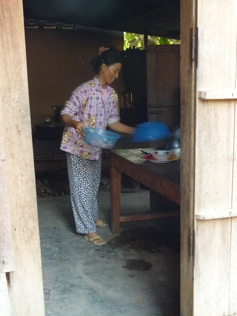 Our hostess prepares our sumptuous food